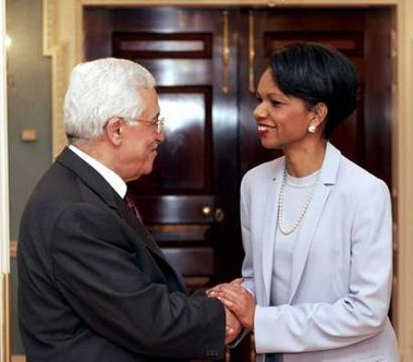 U.S. Secretary of State Condoleezza Rice (R) shakes hands with Palestinian President Mahmoud Abbas at the Treaty Room of the State Department in Washington prior to a working dinner, May 25, 2005. REUTERS
