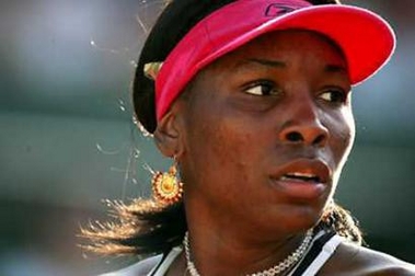 Venus Williams of the U.S reacts during her match against Bulgaria's Sesil Karatantcheva in the third round of the French Open tennis tournament at Roland Garros May 27, 2005. Karatantcheva won 6-3 1-6 6-1. (Philippe Wojazer/Reuters