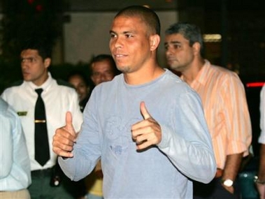 Ronaldo greets people as he arrives to a hospital in Rio de Janeiro, Brazil, on Monday, May 30, 2005. Three-time FIFA Player of the Year Ronaldo was dropped from the Brazilian national team for two upcoming World Cup qualifiers and the Confederations Cup, the Brazilian soccer confederation announced Monday. (AP