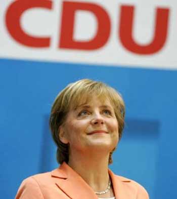 German opposition leader Angela Merkel of the Christian Democratic Union (CDU) smiles following a a party leaders meeting in Berlin May 30, 2005. Germany's opposition chiefs selected Christian Democrat leader Angela Merkel on Monday to challenge Chancellor Gerhard Schroeder at an early election that might make her the country's first woman leader. REUTERS