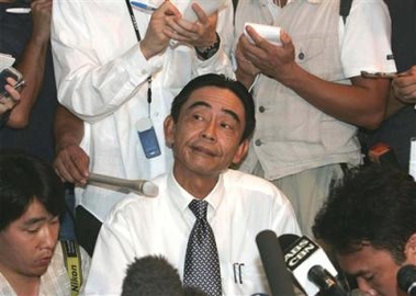 Japanese Consul in Manila Akio Egawa gestures during his news conference Monday May 30, 2005 at a hotel in General Santos city in southern Philippines where he announces the Japanese embassy is pulling out of the city but would still pursue its effort to verify reports that two Japanese Imperial Army soldiers have been found in the mountains of the southern Philippines. 