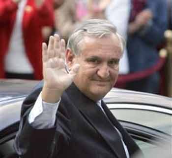 Outgoing Prime Minister Jean-Pierre Raffarin waves as he leaves the premier's office after the handover ceremony in Paris Tuesday, May 31, 2005.