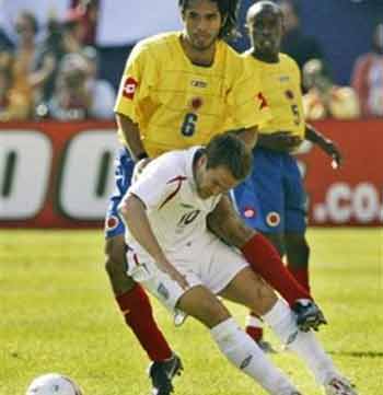 England's Michael Owen (10) battles for the ball with Colombia's Fabian Vargas during the second half of their international friendly match at Giants Stadium, Tuesday, May 31, 2005, in East Rutherford, N.J. Owen scored three goals in their 3-2 win. (AP