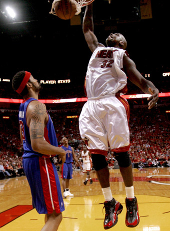 Miami Heata on Miami Heat Center Shaquille O Neal  R  Dunks The Ball Against The