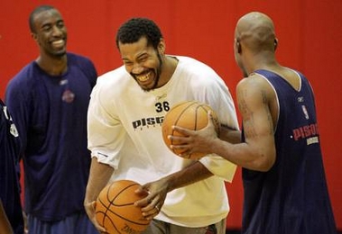 Detroit Pistons forward Rasheed Wallace, center, clowns around with teammates Ron Dupree, left and Chauncey Billups, during their team practice in Auburn Hills, Mich., Friday, June 3, 2005. At stake for the Detroit Pistons in Game 6 against the Miami Heat is so much more than their playoff lives. The outcome will go a long way toward determining whether history will view them as a fluke champion.(AP