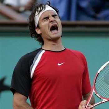 Top-seeded Switzerland's Roger Federer reacts as he plays Spain's Rafael Nadal during their semifinal match of the French Open tennis tournament, at the Roland Garros stadium, Friday June 3, 2005 in Paris. (AP