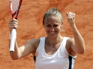 France's Mary Pierce reacts after defeating Russia's Elena Likhovtseva during their semifinal match of the French Open tennis tournament, at the Roland Garros stadium, Thursday June 2, 2005 in Paris. Pierce won 6-1, 6-1. ( AP