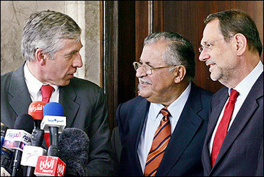 The Iraqi president, Jalal Talabani (C), talks with British Foreign Minister Jack Straw (L) and EU foreign affairs chief Javier Solana during a press conference in Baghdad following a meeting that focused on arrangements for a U.S.-backed June 22 conference.(AFP