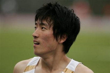 Xiang Liu from China looks up after placing third in the 110-meter hurdles at the Reebok/NYC Grand Prix in New York, Saturday, June 11, 2005. (AP