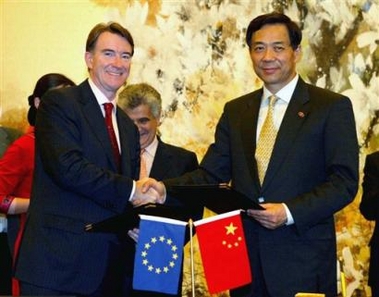 Chinese Commerce Minister Bo Xilai, right, shakes hands with European Union (EU) Trade Commissioner Peter Mandelson at the signing ceremony of the China-EU textile trade agreement in Shanghai early Saturday, June 11, 2005.