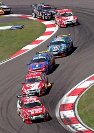 Australia's Steven Richards of Team Perkins Racing leads Australia's Todd Kelly of the Holden Racing Team during Race 3 of the V8 Supercar race, at the Shanghai International Circuit in Shanghai, China June 12, 2005. Kelly won the race and Richards finished the event in second place. REUTERS