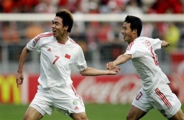 China's soccer player Xuri Zhao celebrates his winning goal in the extra time against Turkey, with teammate Tao Chen, right, during their first round group B World Championships soccer U20 match between China and Turkey at the Galgenwaard stadium in Utrecht, The Netherlands, Saturday June 11, 2005. (AP