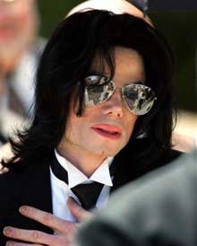 Michael Jackson gestures as he leaves court, Monday, June 13, 2005, in Santa Maria, Calif. Jackson was found not guilty on all counts against him. (AP