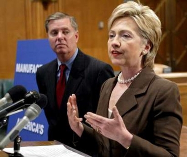U.S. Senator Hillary Clinton (D-NY) (R) talks during a joint news conference with Senator Lindsey Graham (R-SC) on issues concerning jobs in the manufacturing industry in the U.S. on Capitol Hill in Washington D.C. June 14, 2005.