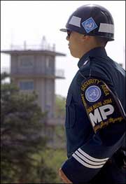 A South Korean soldier stands guard in Panmunjom in the Demilitarized Zone dividing North and South Korea. Eight South Korean soldiers were killed when a soldier went on a shooting rampage near the tense inter-Korean border, the defence ministry said.(AFP/Jung 