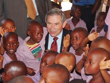 In this photograph released by the World Bank Friday, June 17, 2005, World Bank President Paul Wolfowitz is surrounded by children in an orphanage in Kigali, Rwanda Thursday, June 16, 2005.
