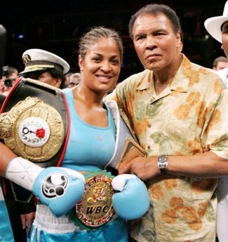 Laila Ali, left, poses with her father, boxing great Muhammad Ali, after her win against Erin Toughill, Saturday, June 11, 2005,at the MCI Center in Washington. (AP