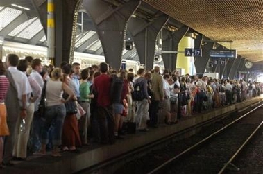 Commuters pack a platform waiting for a diesel train in the main train station during a blackout in Zurich, Switzerland, Wednesday, June 22, 2005. Due to a nationwide power failure, the entire SBB CFF train system of Switzerland was shut down, leaving thousands of commuters stranded in trains and stations. (AP
