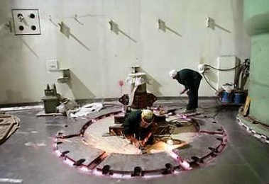 Russian workers work inside a reactor building at the nuclear plant in the southwestern Iranian city of Bushehr June 22, 2005.