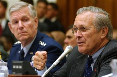 Defense Secretary Donald Rumsfeld, right, testifies on the progress of Iraqi security forces on Capitol Hill Thursday, June 23, 2005, before the House Armed Services Committee. Chairman of the Joint Chiefs of Staff Gen. Richard Myers is at left. (AP 