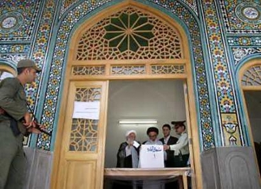 Iranian clerics cast their votes at a mosque in Qom, 120 km (75 miles) south of Tehran, June 24, 2005. 