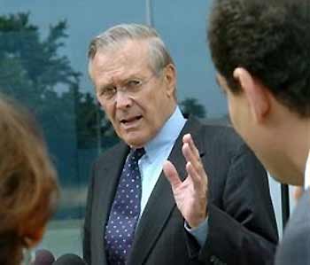 Defense Secretary Donald Rumsfeld talks with reporters after appearing on NBC's Meet The Press on Sunday, June 26, 2005 in Washington. (AP