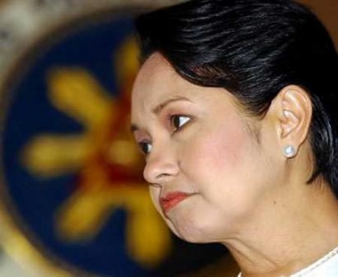 Philippine President Gloria Macapagal Arroyo is seen during an earlier engagement hours before her live address telecast from Manila's Malacanang presidential palace June 27, 2005.