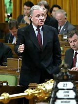 Canadian Prime Minister Paul Martin stands to speak in the House of Commons on Parliament Hill in Ottawa June 27, 2005. Canada's Parliament on Tuesday approved legislation to allow same sex marriages across the country, despite fierce opposition from conservative politicians and religious groups.