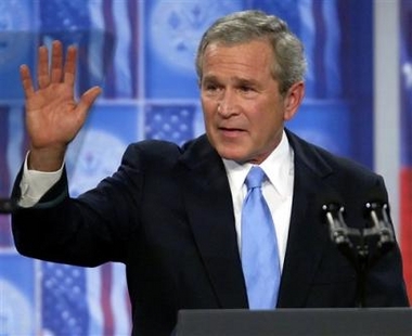 US President Bush waves after addressing troops during a visit to Fort Bragg, N.C. Tuesday June 28, 2005, on the one year anniversary of Iraq's revived sovereignty. [AP]