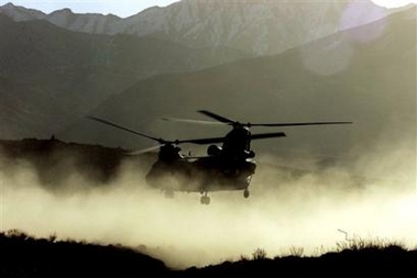 A U.S. Army CH-47 Chinook helicopter lands in the Shah-e-Kot mountains, 25 kilometers (15 miles) southeast of Gardez, Afghanistan in this March 15, 2002 file photo.