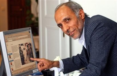 Iranian Bijan Adibi, a former hostage-taker points to a photo on screen which shows a U.S hostage and an Iranian during the 1979 seizure of the U.S. Embassy in Tehran, on Thursday 30, 2005. Adibi, said new president-elect Mahmoud Ahmadinejad 'was not involved.