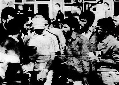 This file photo shows a blindfolded US hostage 08 November 1979 being paraded by his captors in the compound of the US Embassy Tehran, Iran. The United States is still looking into claims by former hostages that Iran's president-elect Mahmood Ahmadinejad was a leader of the seige in 1979(AFP/File