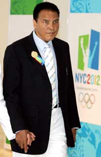 Boxing icon Muhammad Ali arrives to the opening of the 117th International Olympic Committee session to make New York City's bid for the 2012 Olympic games in Singapore July 6, 2005.