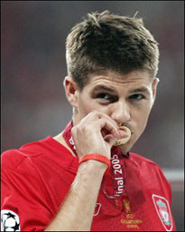 Liverpool captain Steven Gerrard kisses his winner's medal at the end of the Champions League final against AC Milan in May 2005. Liverpool chief executive Rick Parry said Gerrard had changed his mind and was staying with the club.[AFP]