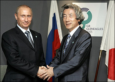 Russian President Vladimir Putin(L) meets with Japanese Prime Minister Junichiro Koizumi during a bilateral meeting at the G8 summit in Gleneagles. Putin will visit Japan in November for talks aimed at ending a World War II land dispute.(AFP