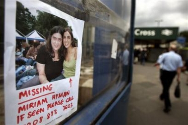 A poster left by relatives or friends of a missing person is seen where it has been hung near the entrance of the King's Cross Underground Station that was hit by an explosion Thursday, in central London, Friday July 8, 2005. 