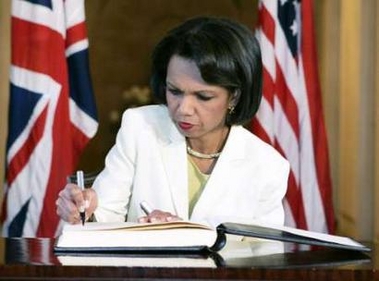 U.S. Secretary of State Condoleezza Rice signs a book of condolences at the British Embassy in Washington July 7, 2005.