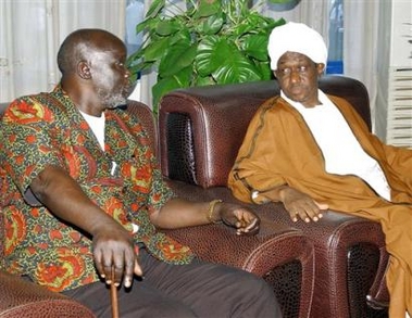 Former Sudanese rebel leader John Garang, left, meets Friday July 8, 2005, with the Sudanese First Vice president Ali Osman Mohamed Taha whom he will replace in Khartoum, Sudan Friday, July 8, 2005. Garang set foot in the capital for the first time in 22 years Friday, ahead of his swearing in to the position of first vice president. (AP