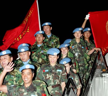Chinese peacekeepers arrive at the Capital International Airport in Beijing July 11, 2005. They spent more than six months in Liberia, carrying out U.N. peacekeeping missions. [newsphoto]