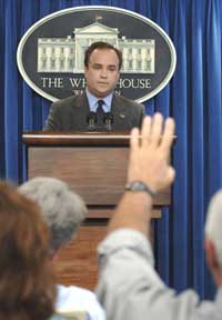 White House spokesman Scott McClellan takes a question from a reporter during the daily briefing at the White House in Washington, D.C., July 11, 2005. McCellan was questioned vigorously by members of the media about allegations that Deputy White House Chief of Staff, Karl Rove, leaked classified information about the identity of an operative for the CIA.