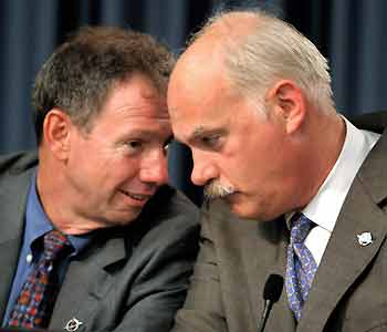 NASA Administrator Mike Griffin (L) speaks with Associate Administrator William Ready during a news conference after launch of the space shuttle Discovery was delayed at the Kennedy Space Center in Cape Canaveral, Florida, July 13, 2005. [Reuters]
