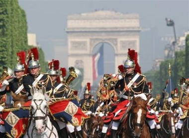 Mounted Republican Guards parade on the Champs Elysees, in celebration of Bastille Day in Paris, Thursday, July 14, 2005. France celebrated its national day under tight security to ward off any possible terrorist attacks. (AP