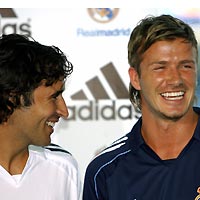 Real Madrid's David Beckham (R) and captain Raul smile as they pose during the presentation ceremony of the team's new kit for the upcoming season at Santiago Bernabeu stadium July 13, 2005. 