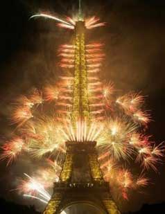 Fireworks illuminate the Eiffel Tower in Paris during Bastille Day celebration Thursday, July 14, 2005. (AP