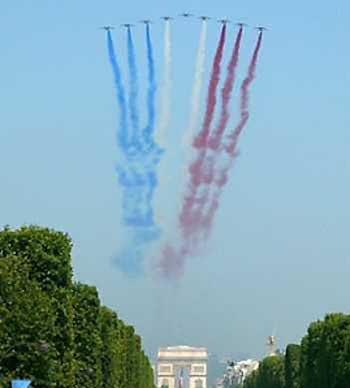 French Alphajets trail the national colours over the Avenue des Champs Elysees in Paris July 14, 2005 at the start of the annual Bastille Day parade. 