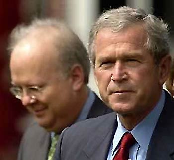 White House Deputy Chief of Staff Karl Rove (L) and President George W. Bush depart the White House in Washington for a day trip to North Carolina, in this file photo taken July 15, 2005. 
