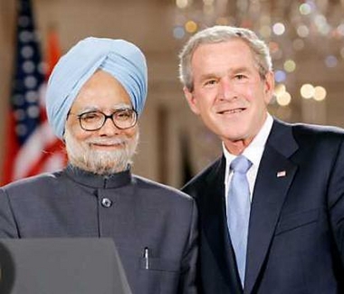 President George W. Bush (R) poses with India Prime Minister Manmohan Singh in the East Room of the White House after a joint press availability July 18, 2005. 
