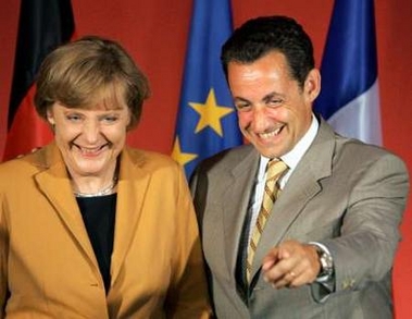 French Interior Minister and UMP party President Nicolas Sarkozy (R) poses with German CDU President Angela Merkel following a press conference at UMP Presidential party headquarters in Paris, July 19, 2005. 