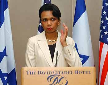 U.S. Secretary of State Condoleezza Rice listens listens to questions during a news conference in Jerusalem July 21, 2005. Secretary Rice flew into the Middle East on Thursday to try to smooth Israel's planned withdrawal from the occupied Gaza Strip and bolster a ceasefire with the Palestinians. REUTERS