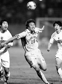 An undated file picture shows Chongqing Lifan striker Shi Jun in action in a Super League match.
